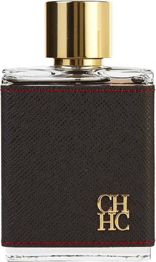 Flacon wody toaletowej Carolina Herrera CH Men 100ml w ciemnym opakowaniu ze złotymi akcentami na białym tle - perfumy męskie orientalne