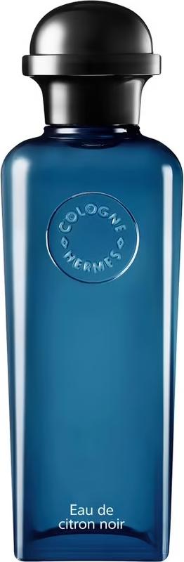 Flacon wody kolońskiej HERMÈS Eau de citron noir w eleganckiej butelce z logo marki, unisex perfumy cytrusowe na białym tle