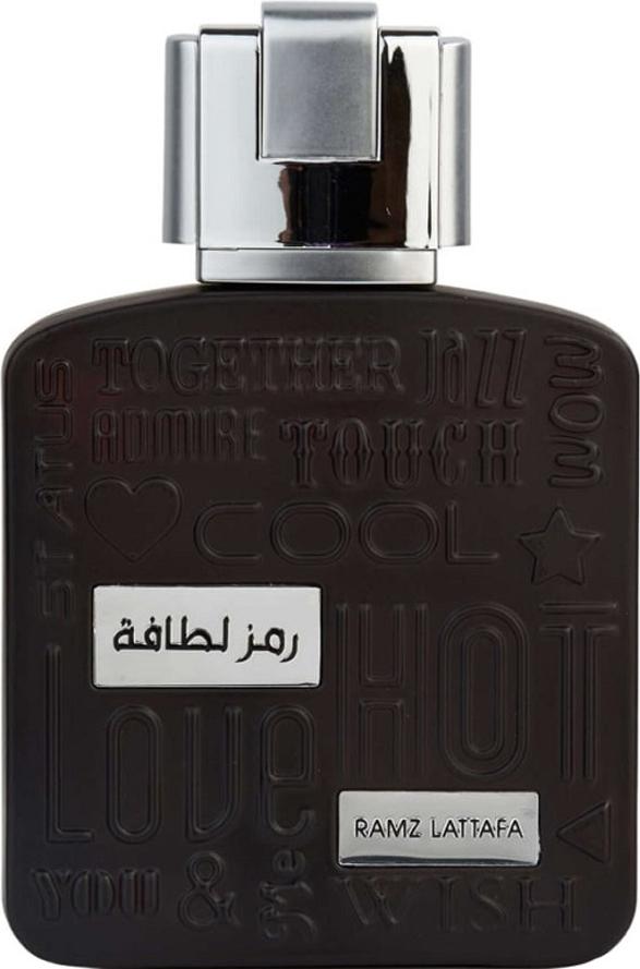 Lattafa Ramz Silver woda perfumowana 100ml w eleganckim czarnym flakonie ze srebrną zatyczką na białym tle - orientalny zapach unisex